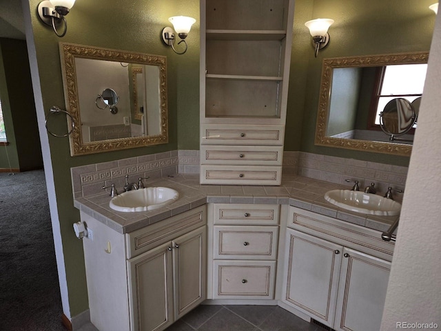 bathroom featuring tile patterned flooring and vanity