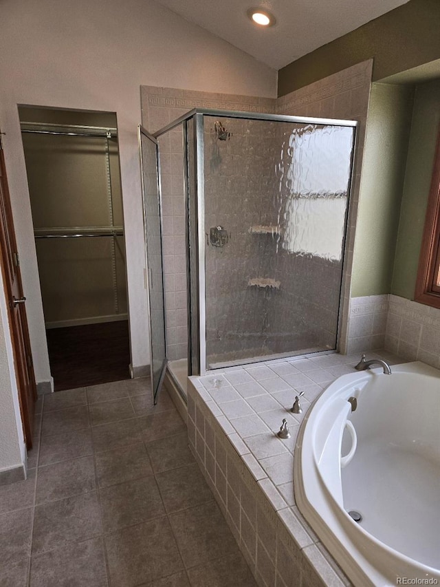 bathroom with tile patterned flooring and plus walk in shower