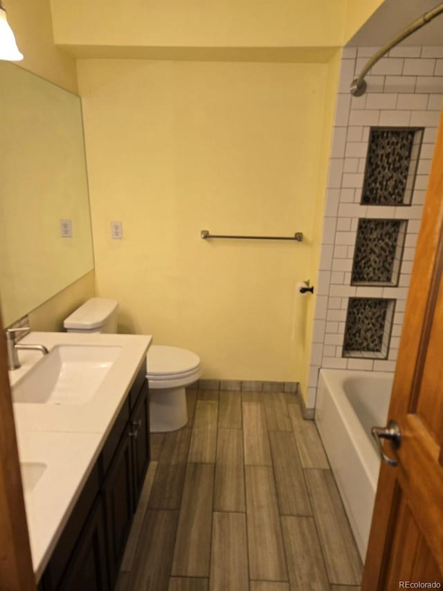 21064 E Crestline Cir, Centennial, CO 80015 - bathroom with toilet, wood finish floors, washtub / shower combination, and double vanity