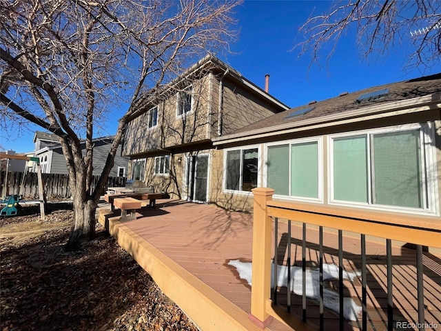 rear view of house with a wooden deck