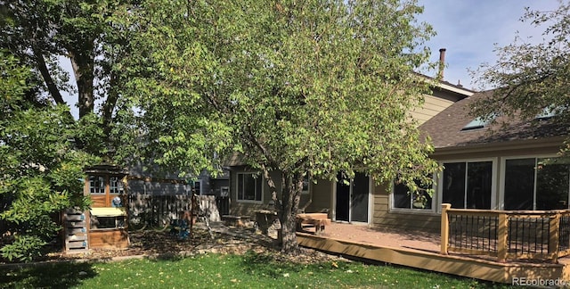 21064 E Crestline Cir, Centennial, CO 80015 - back of house with a deck and roof with shingles
