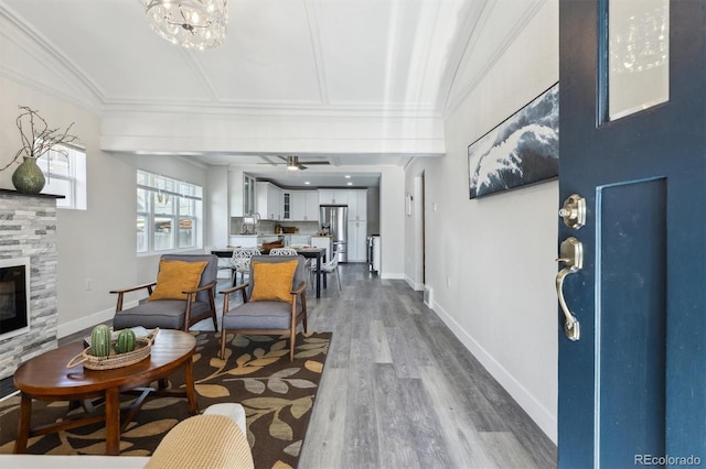 3929 Federal Blvd, Denver, CO 80211 - living area featuring a tile fireplace, dark wood-type flooring, baseboards, and ceiling fan