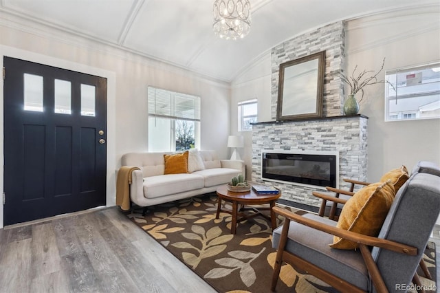 3929 Federal Blvd, Denver, CO 80211 - living area featuring wood finished floors, lofted ceiling, and a fireplace
