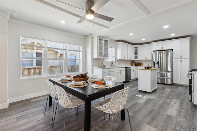 3929 Federal Blvd, Denver, CO 80211 - dining area with baseboards, recessed lighting, dark wood-style flooring, ornamental molding, and ceiling fan