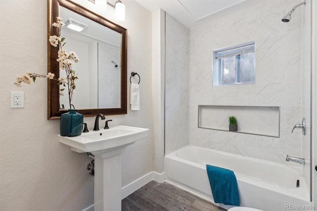 3929 Federal Blvd, Denver, CO 80211 - bathroom with baseboards, wood finished floors, and bathing tub / shower combination