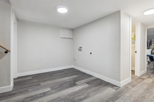 3929 Federal Blvd, Denver, CO 80211 - washroom featuring electric dryer hookup, hookup for a washing machine, wood finished floors, and baseboards