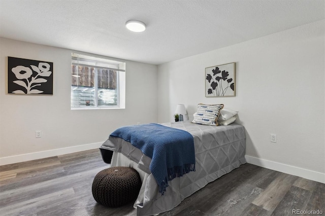 3929 Federal Blvd, Denver, CO 80211 - bedroom with wood finished floors, baseboards, and a textured ceiling