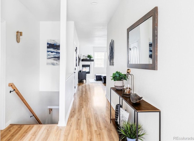 hall with light hardwood / wood-style flooring