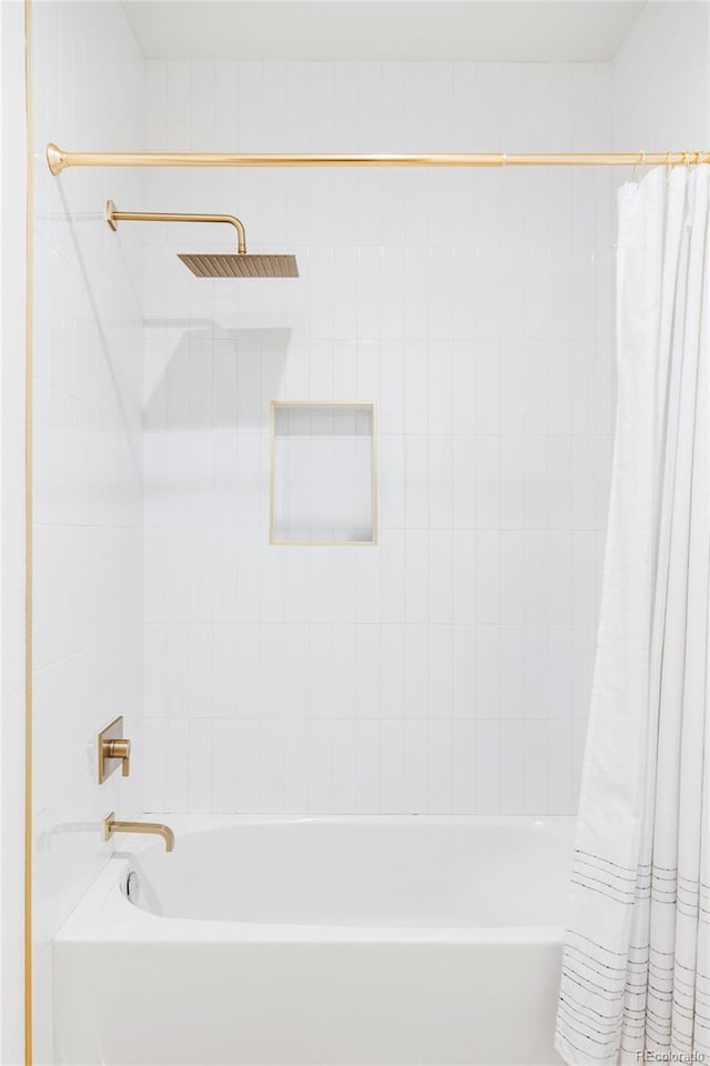 bathroom featuring shower / bath combo with shower curtain