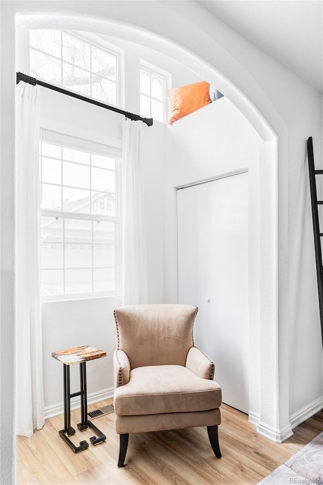 sitting room with light hardwood / wood-style flooring