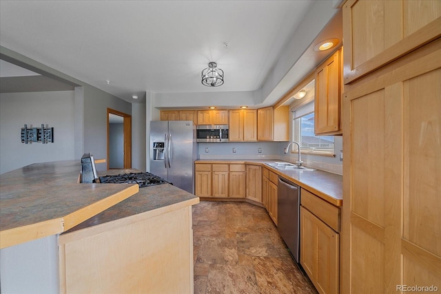 32800 E 137th Way, Brighton, CO 80603 - kitchen featuring stainless steel appliances, a sink, stone finish floors, and light brown cabinetry