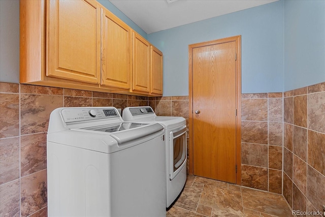 32800 E 137th Way, Brighton, CO 80603 - laundry area with tile walls, independent washer and dryer, cabinet space, and stone finish flooring