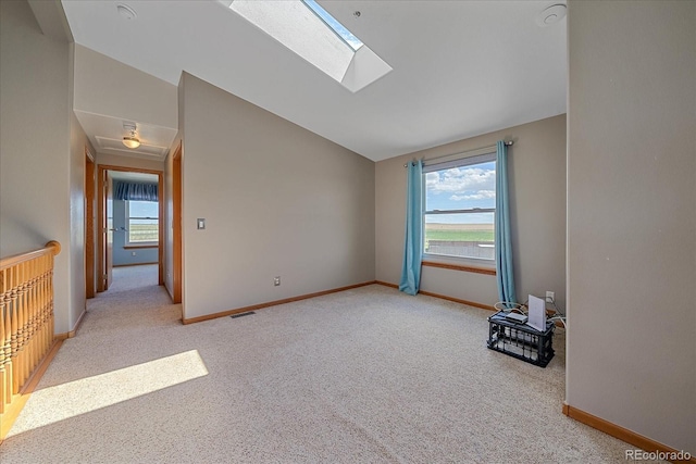 32800 E 137th Way, Brighton, CO 80603 - unfurnished room with lofted ceiling, a skylight, carpet, and baseboards