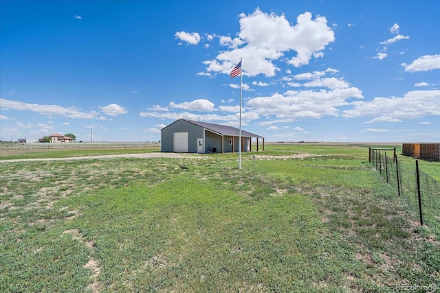 32800 E 137th Way, Brighton, CO 80603 - view of yard with a rural view, an outbuilding, a detached garage, and driveway