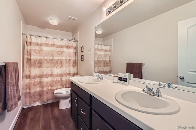 286 Western Sky Cir, Longmont, CO 80501 - full bath featuring wood finished floors, double vanity, and curtained shower