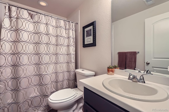 286 Western Sky Cir, Longmont, CO 80501 - bathroom featuring vanity, a textured wall, and a shower with curtain