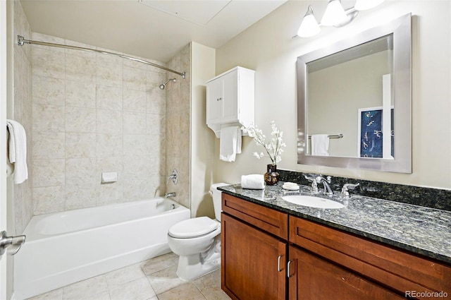 bathroom with toilet, tile patterned floors, vanity, and shower / bathtub combination