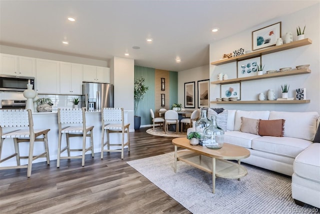 living area with recessed lighting and dark wood-type flooring