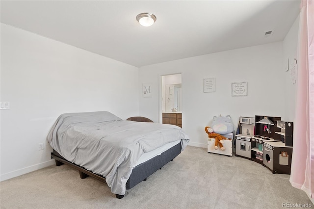 bedroom featuring light carpet and baseboards