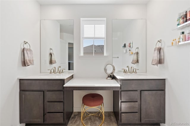 full bath with two vanities and a sink