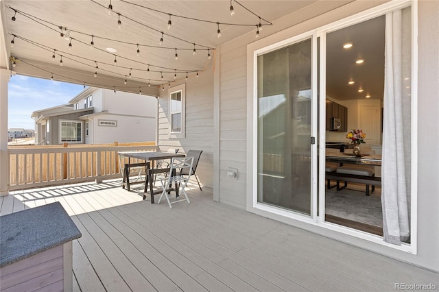 wooden deck with outdoor dining area