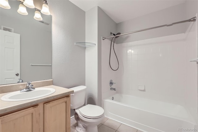 full bathroom with tile patterned floors, toilet, shower / bathing tub combination, and vanity