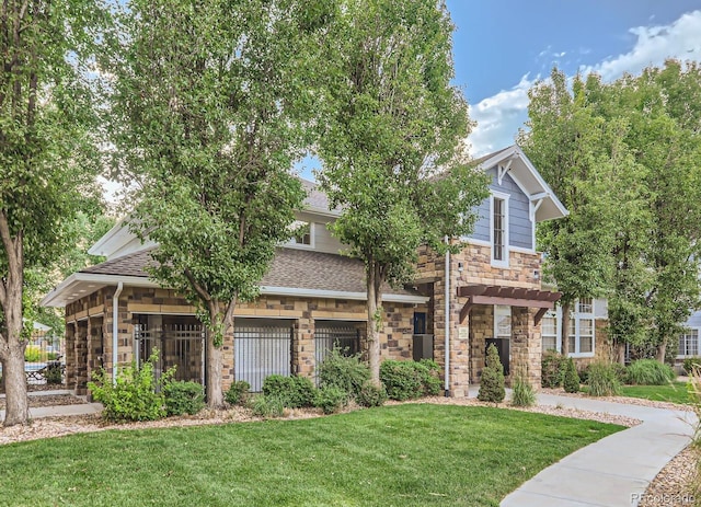 view of front of property with a pergola and a front lawn