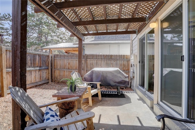 view of patio with a fenced backyard, a pergola, and grilling area