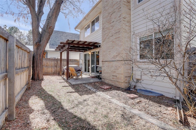 view of yard with a patio area and a fenced backyard