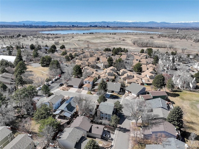 aerial view with a residential view and a water and mountain view