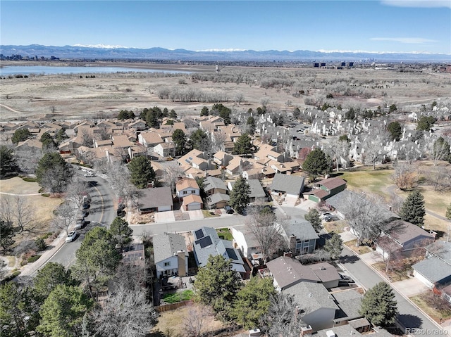 aerial view featuring a residential view and a water and mountain view