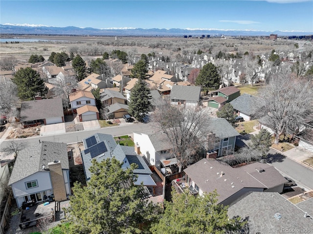 birds eye view of property with a mountain view and a residential view