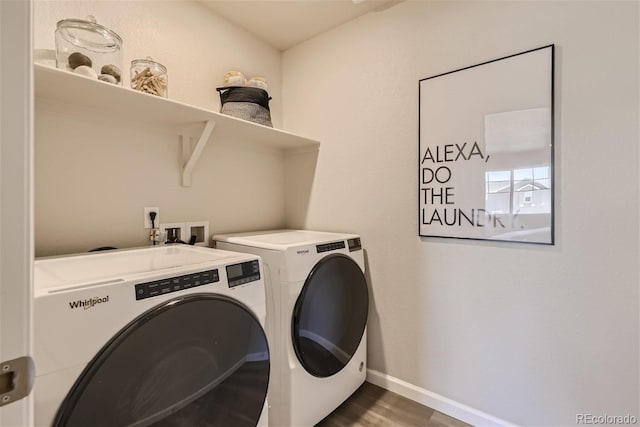 clothes washing area with washing machine and clothes dryer