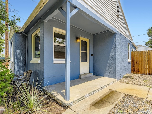 2102 S Pearl St, Denver, CO 80210 - doorway to property with stucco siding