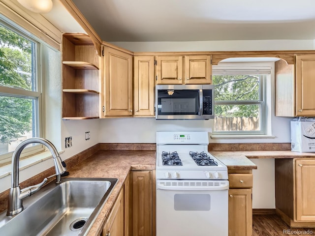 2102 S Pearl St, Denver, CO 80210 - kitchen featuring white gas stove, stainless steel microwave, open shelves, light brown cabinets, and wood finished floors