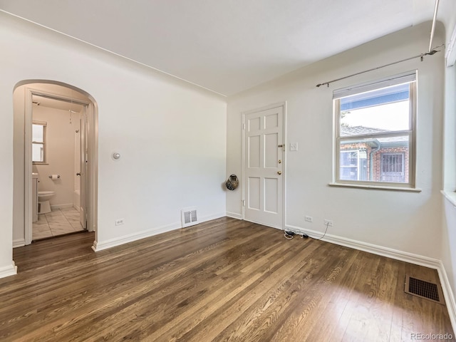 2102 S Pearl St, Denver, CO 80210 - spare room with arched walkways and wood finished floors