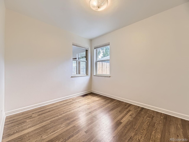 2102 S Pearl St, Denver, CO 80210 - spare room with wood finished floors and baseboards
