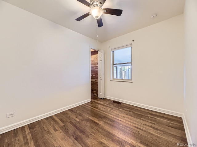 2102 S Pearl St, Denver, CO 80210 - empty room with dark wood-style flooring, a smoke detector, and ceiling fan