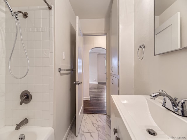 2102 S Pearl St, Denver, CO 80210 - full bath featuring marble look tiles and shower / bath combination