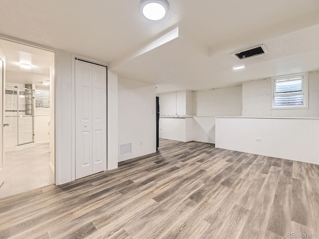 2102 S Pearl St, Denver, CO 80210 - below grade area featuring wood finished floors