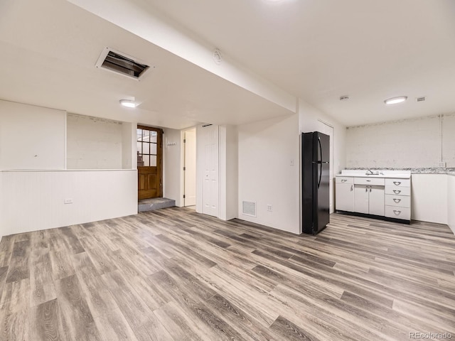 2102 S Pearl St, Denver, CO 80210 - unfurnished living room featuring light wood finished floors