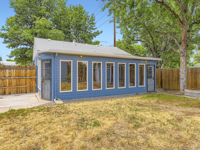2102 S Pearl St, Denver, CO 80210 - rear view of house with a fenced backyard