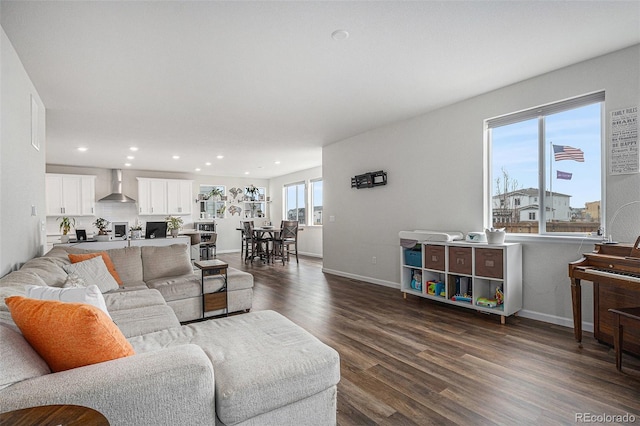 living room with recessed lighting, baseboards, and dark wood-style floors
