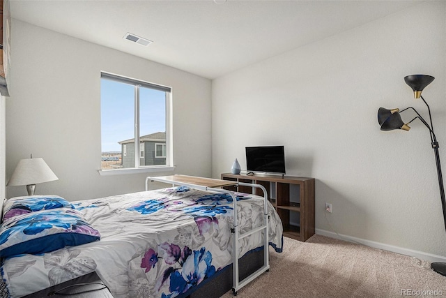 bedroom featuring carpet floors, baseboards, and visible vents
