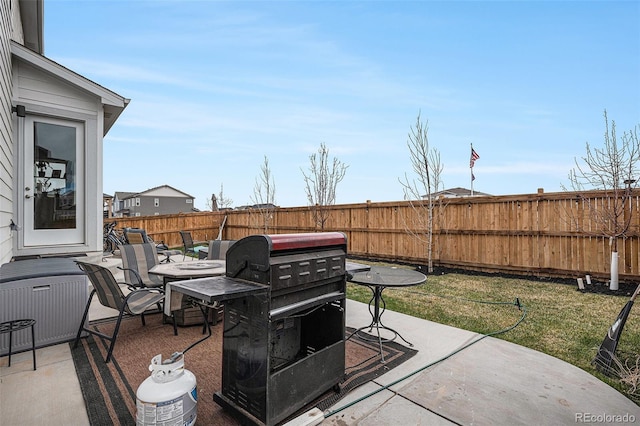view of patio with a fenced backyard and area for grilling
