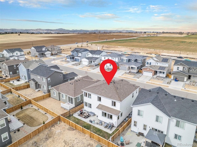 drone / aerial view with a residential view and a mountain view