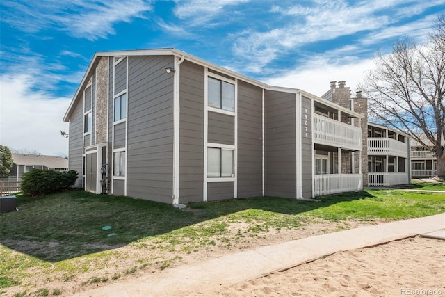 18071 E Kentucky Ave Unit 203, Aurora, CO 80017 - view of side of property featuring a chimney