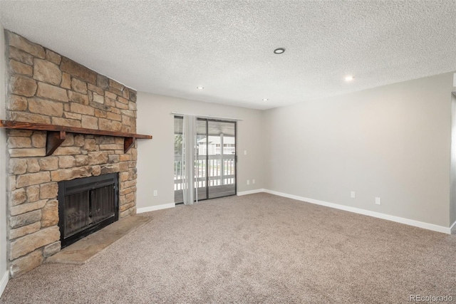 18071 E Kentucky Ave Unit 203, Aurora, CO 80017 - unfurnished living room with a fireplace, carpet flooring, baseboards, a textured ceiling, and recessed lighting