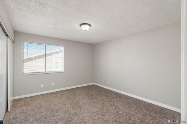 18071 E Kentucky Ave Unit 203, Aurora, CO 80017 - unfurnished room with carpet flooring, a textured ceiling, and baseboards