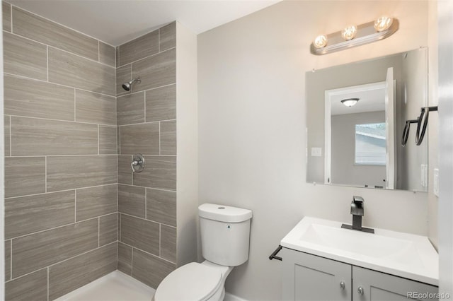 18071 E Kentucky Ave Unit 203, Aurora, CO 80017 - full bathroom with toilet, tiled shower, and vanity